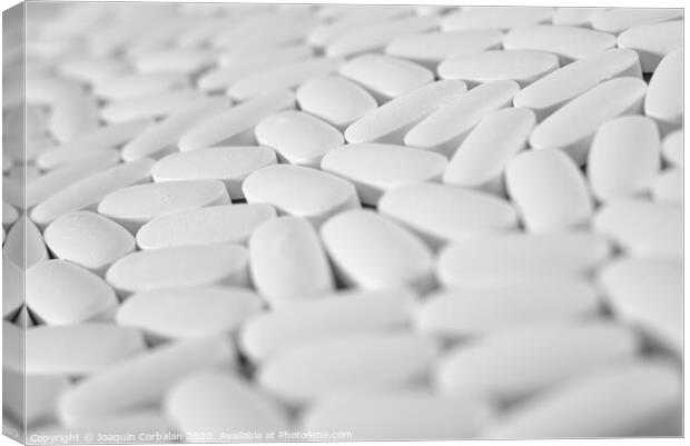 Macro close-up of many white pills, medication concept Canvas Print by Joaquin Corbalan
