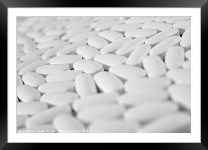 Macro close-up of many white pills, medication concept Framed Mounted Print by Joaquin Corbalan