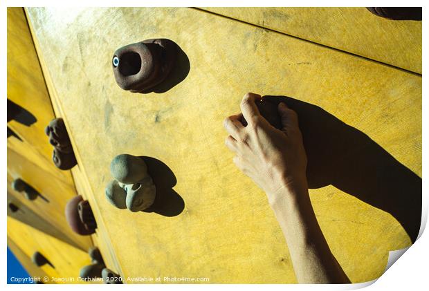 Hand of a person trying to climb the fixie of a climbing wall Print by Joaquin Corbalan