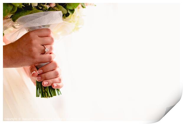 A woman's hand with wedding ring while holding her bouquet, plenty of white copy space. Print by Joaquin Corbalan