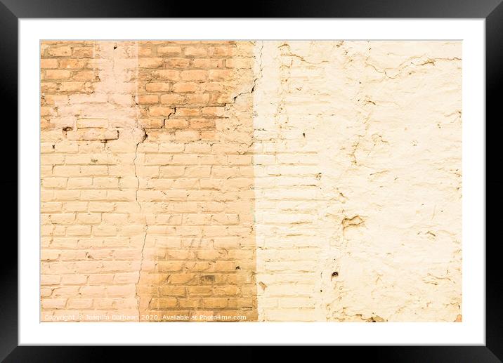Texture of a brick wall painted in orange tones, ideal for background with space for free text. Framed Mounted Print by Joaquin Corbalan