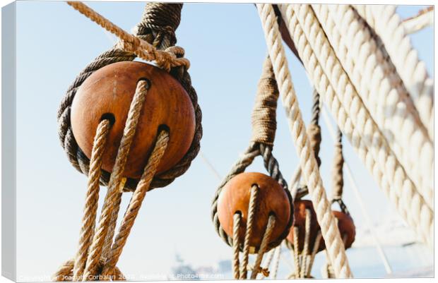 Rigging and ropes on an old sailing ship to sail in summer. Canvas Print by Joaquin Corbalan