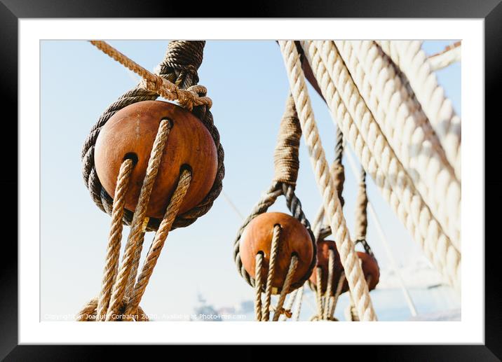 Rigging and ropes on an old sailing ship to sail in summer. Framed Mounted Print by Joaquin Corbalan