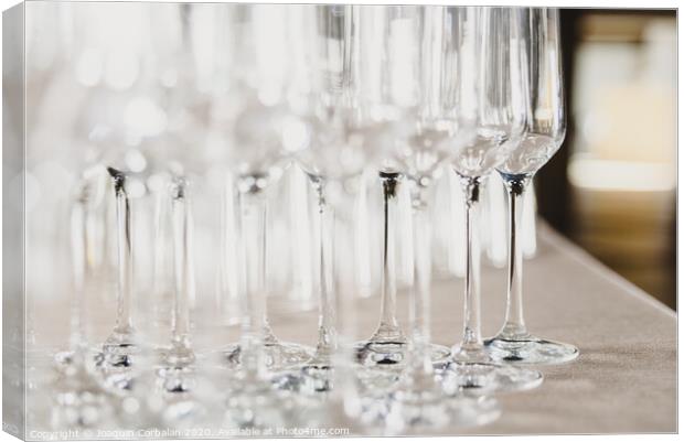 Group of empty and transparent champagne glasses in a restaurant.Group of empty and transparent champagne glasses in a restaurant. Canvas Print by Joaquin Corbalan