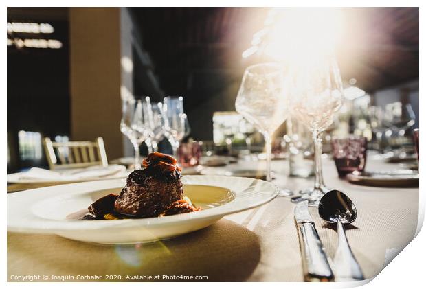 Exquisite veal dish with sauce served in luxury cutlery with sunbeams in a restaurant. Print by Joaquin Corbalan