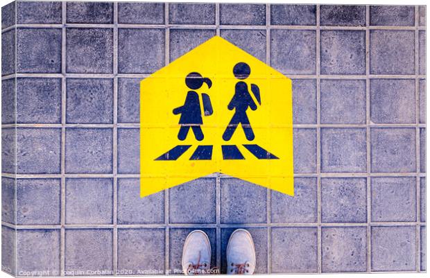 Foot standing on a street a safe way mark for children on the way to school. Canvas Print by Joaquin Corbalan