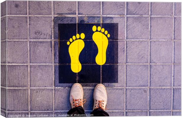 Foot standing on a street a safe way mark for children on the way to school. Canvas Print by Joaquin Corbalan