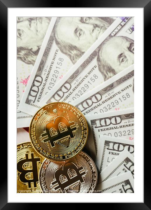 Gold and silver bitcoins on hundred-dollar American bills. Framed Mounted Print by Joaquin Corbalan