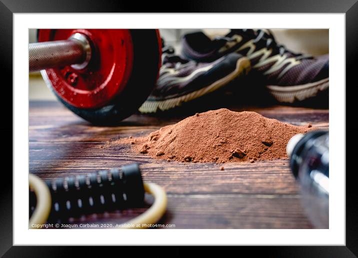 Athletes need to consume extra protein powder supplement, in the image with cocoa flavor, to improve their sports performance. Framed Mounted Print by Joaquin Corbalan