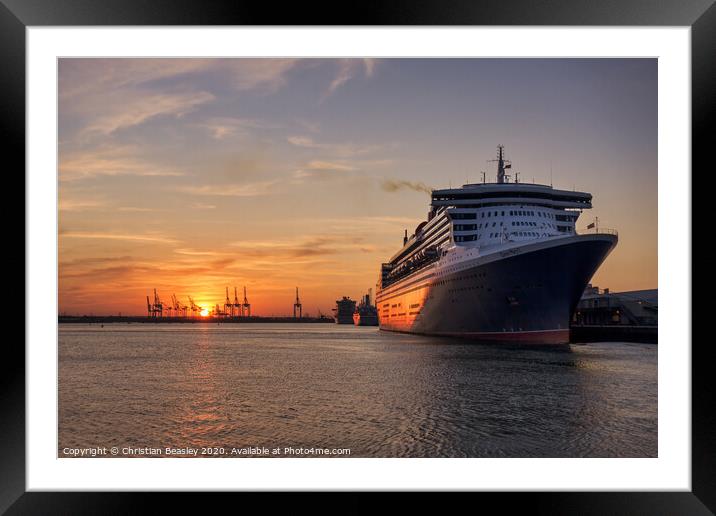 Queen Mary 2 in Southampton at sunset Framed Mounted Print by Christian Beasley