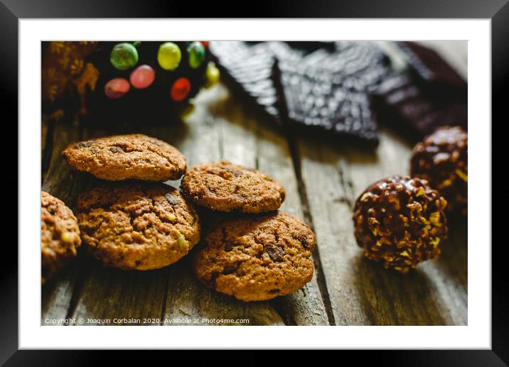 Black chocolate filled with mint cream on wooden background Framed Mounted Print by Joaquin Corbalan