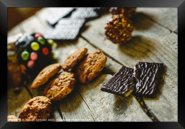 Chip cookies and chocolates pralines to take pleasure in Christmas holidays Framed Print by Joaquin Corbalan