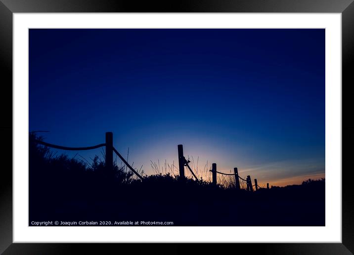 Cold sunset with silhouette of beach dunes Framed Mounted Print by Joaquin Corbalan