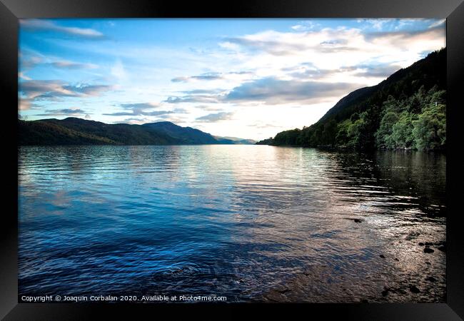 Blue lake among tranquil woods to relax with calm on vacation Framed Print by Joaquin Corbalan