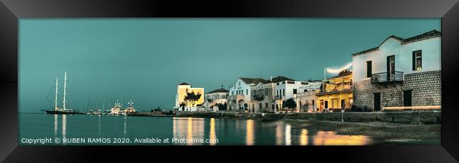 The Spetses Island waterfront over a cloudy sky at Framed Print by RUBEN RAMOS