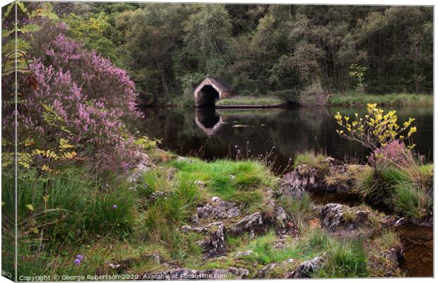 Purple heather and reflections of an Old Boathouse Canvas Print by George Robertson