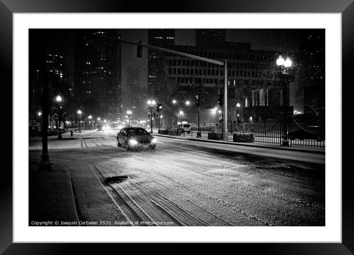 Urban scenes of snowy city at night Framed Mounted Print by Joaquin Corbalan