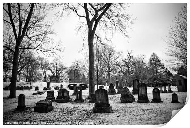 black and white snowy graveyard with aged tombstones Print by Joaquin Corbalan