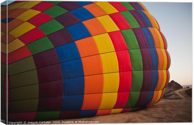 Colorful balloons flying over mountains and with blue sky Canvas Print by Joaquin Corbalan