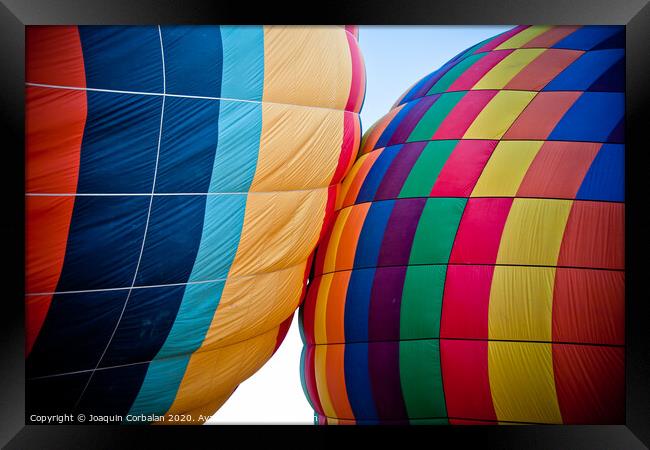Colorful balloons flying over mountains and with blue sky Framed Print by Joaquin Corbalan