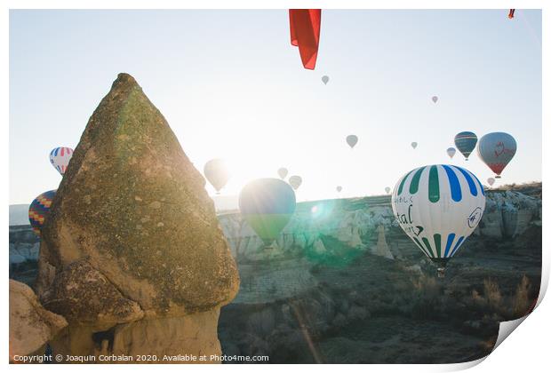 Colorful balloons flying over mountains and with blue sky in cappadocia. Print by Joaquin Corbalan