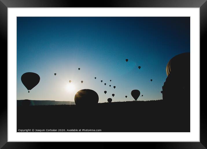 Colorful balloons flying over mountains and with blue sky Framed Mounted Print by Joaquin Corbalan