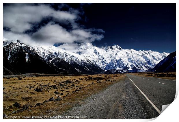 Snowy mountains among clouds from road Print by Joaquin Corbalan