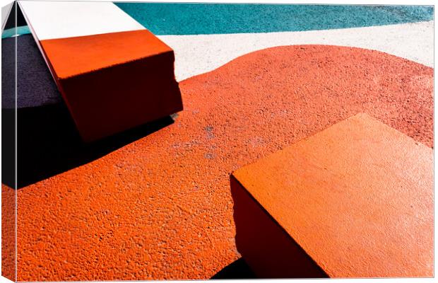 Asphalt floor painted in orange, with concrete blocks of harsh shadows of sunlight, abstract background. Canvas Print by Joaquin Corbalan