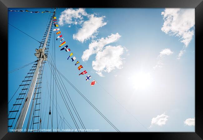 A classic sailboat moored to port Framed Print by Joaquin Corbalan