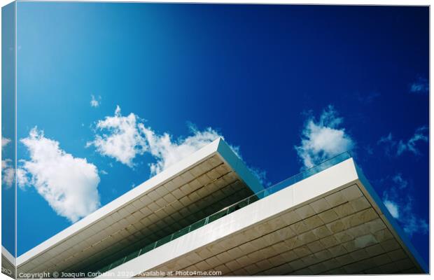 Blue sky background with clouds and a roof of modern financial business building. Canvas Print by Joaquin Corbalan