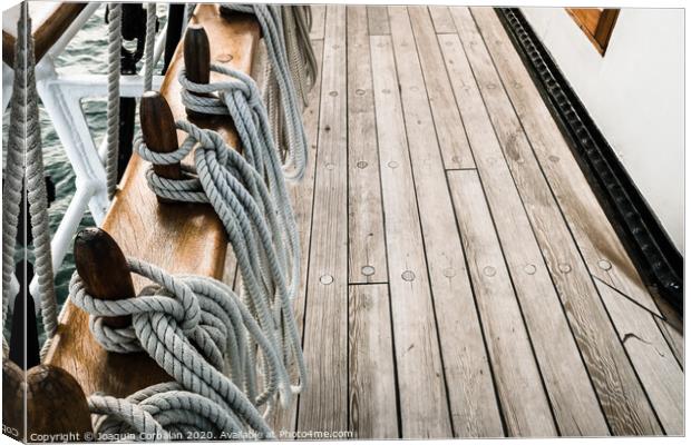 Ropes on a sailboat to tighten the sails of the ship during a cruise for tourists. Canvas Print by Joaquin Corbalan