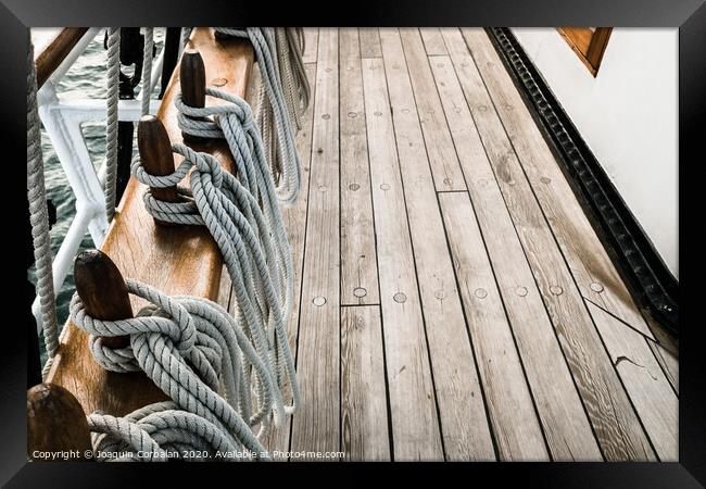 Ropes on a sailboat to tighten the sails of the ship during a cruise for tourists. Framed Print by Joaquin Corbalan