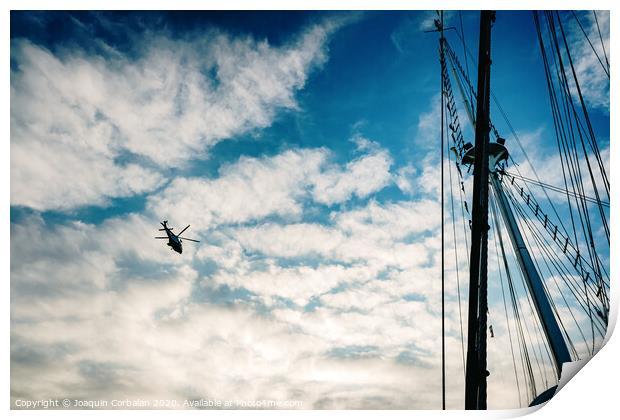  Rescue helicopter flying over a sailboat, seen from the sea. Print by Joaquin Corbalan
