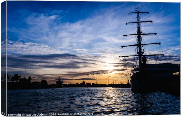 A classic sailboat moored to port in a beautiful sunset. Canvas Print by Joaquin Corbalan