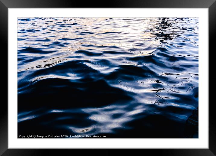 Natural seawater background with its intense bluish liquid texture at sunset. Framed Mounted Print by Joaquin Corbalan