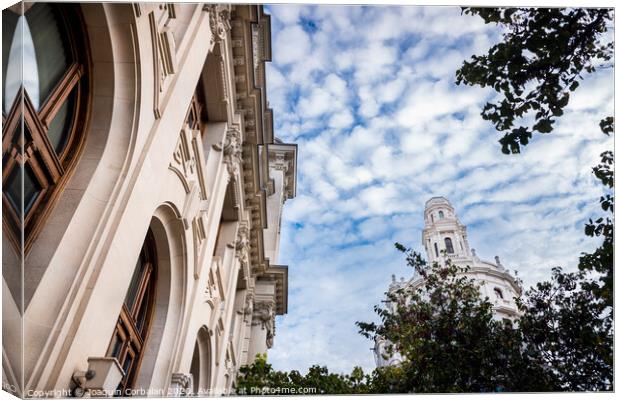 Facade of large institutional building with large columns and windows, background sky, low angle shot, in Valencia. Canvas Print by Joaquin Corbalan
