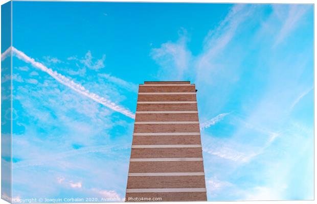 High housing building with blue sky in the background and copy space. Canvas Print by Joaquin Corbalan