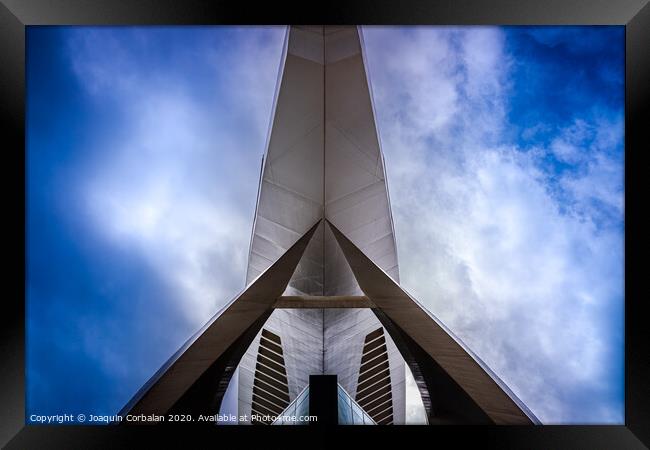 Modernist building with futuristic space design seen with the background of a dramatic blue sky. Framed Print by Joaquin Corbalan