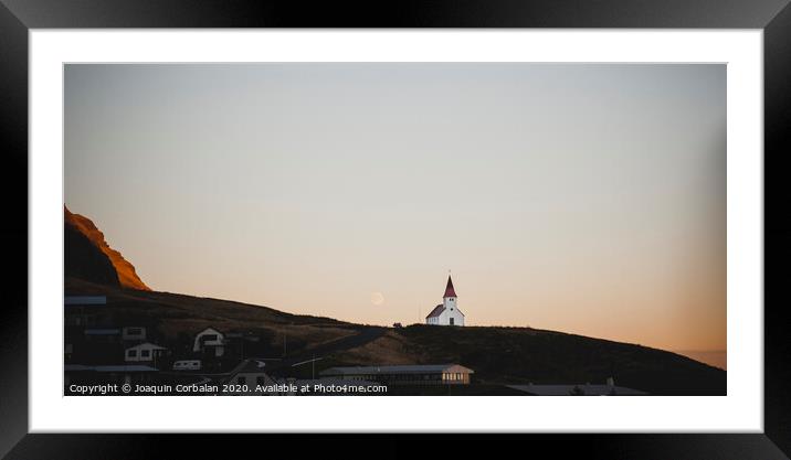 Church on top of a hill and under a mountain, with the moon in the background. Framed Mounted Print by Joaquin Corbalan