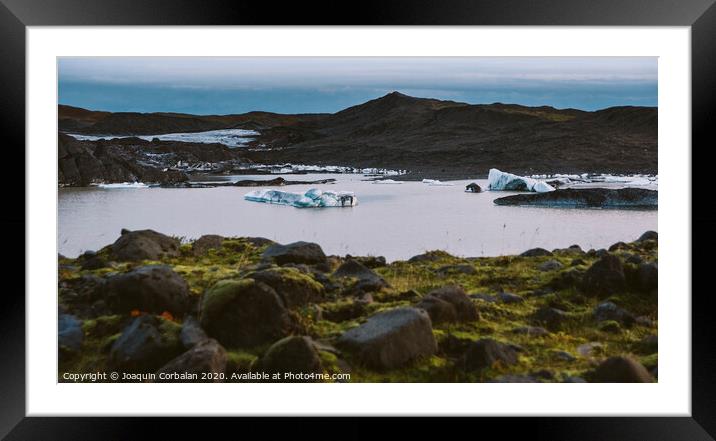 Large blocks of broken ice from an Icelandic glacier. Framed Mounted Print by Joaquin Corbalan