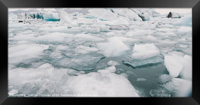 Glacier lake full of large blocks of ice. Framed Print by Joaquin Corbalan