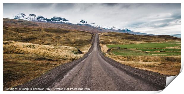 Gravel road in the snowy mountains of Iceland after a rainy day with mud Print by Joaquin Corbalan