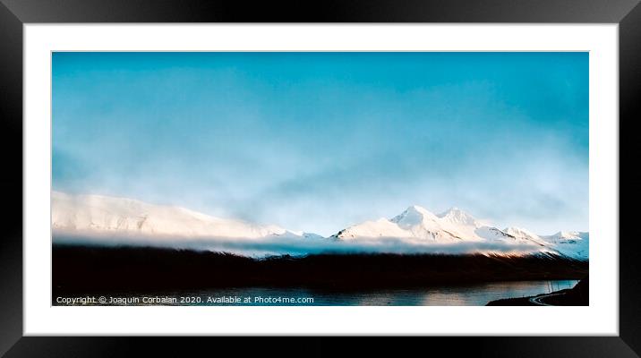 Beautiful scene of a landscape with high snowy mountains and sea. Framed Mounted Print by Joaquin Corbalan