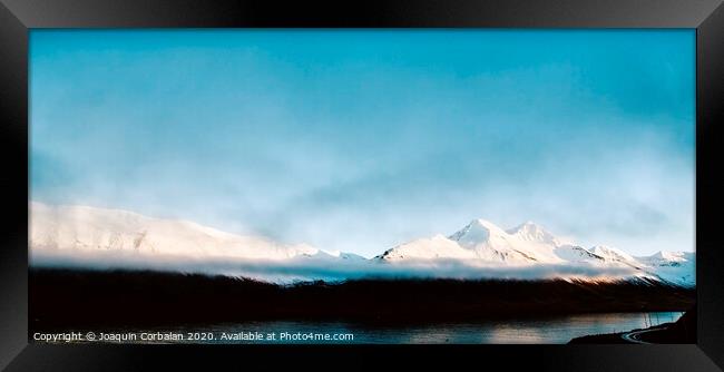 Beautiful scene of a landscape with high snowy mountains and sea. Framed Print by Joaquin Corbalan