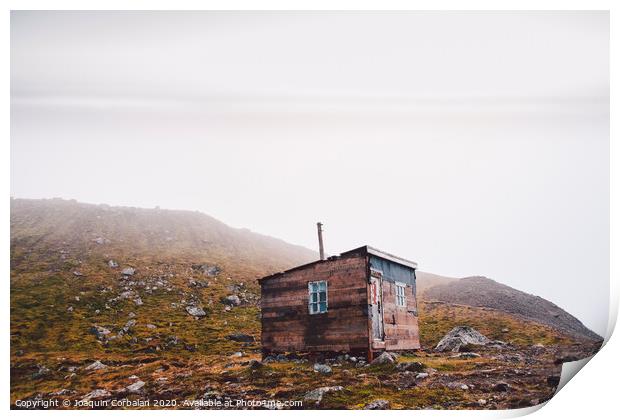 Small wooden hut on top of a mountain surrounded by fog in winter to seek solitude. Print by Joaquin Corbalan