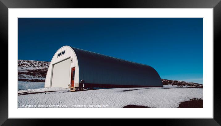 Warehouse road maintenance material on top of a snowy mountain. Framed Mounted Print by Joaquin Corbalan