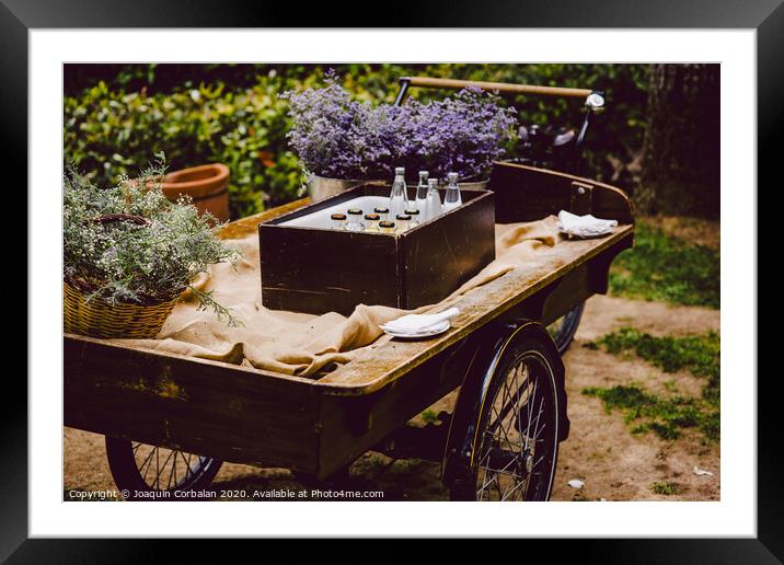 Old wooden cart to transport goods used for decoration at a wedding. Framed Mounted Print by Joaquin Corbalan