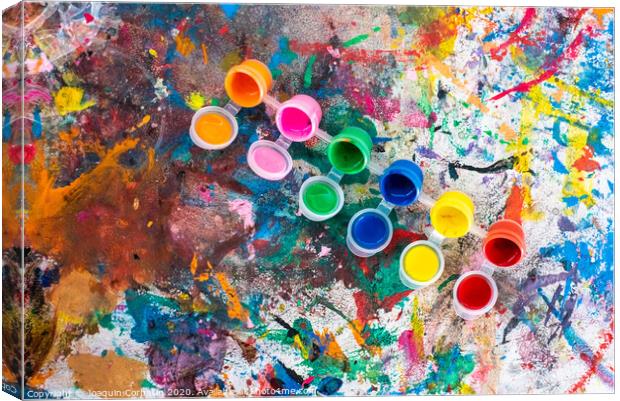 Bottles of paint of various colors to decorate plaster objects. Canvas Print by Joaquin Corbalan