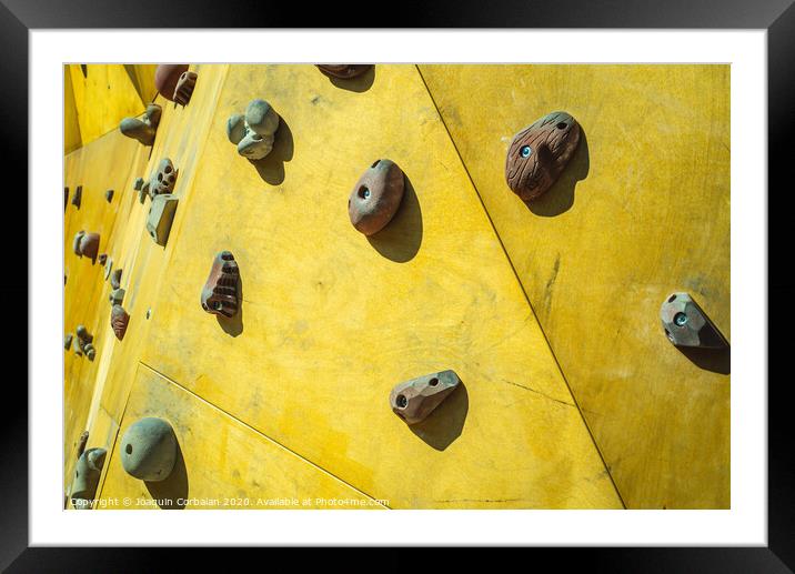 Detail of the wall of an outdoor climbing wall to practice climbing Framed Mounted Print by Joaquin Corbalan