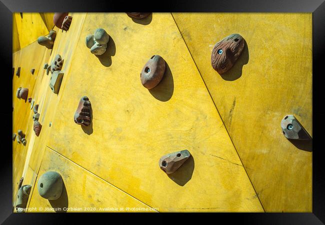 Detail of the wall of an outdoor climbing wall to practice climbing Framed Print by Joaquin Corbalan